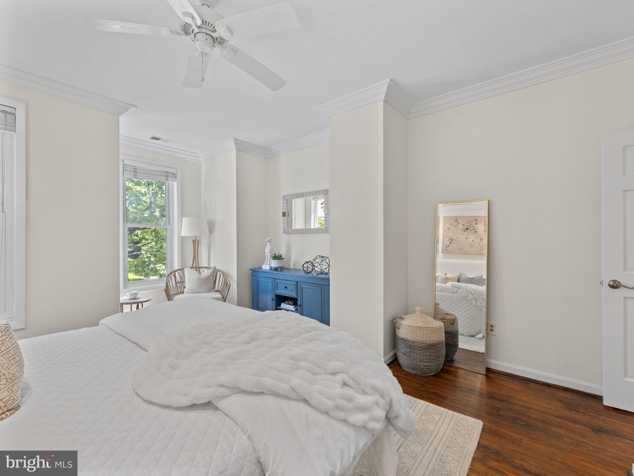 407 5th Street Northeast Washington, DC 20002 - Photo 20 of 41 a bedroom with a bed and wooden floor