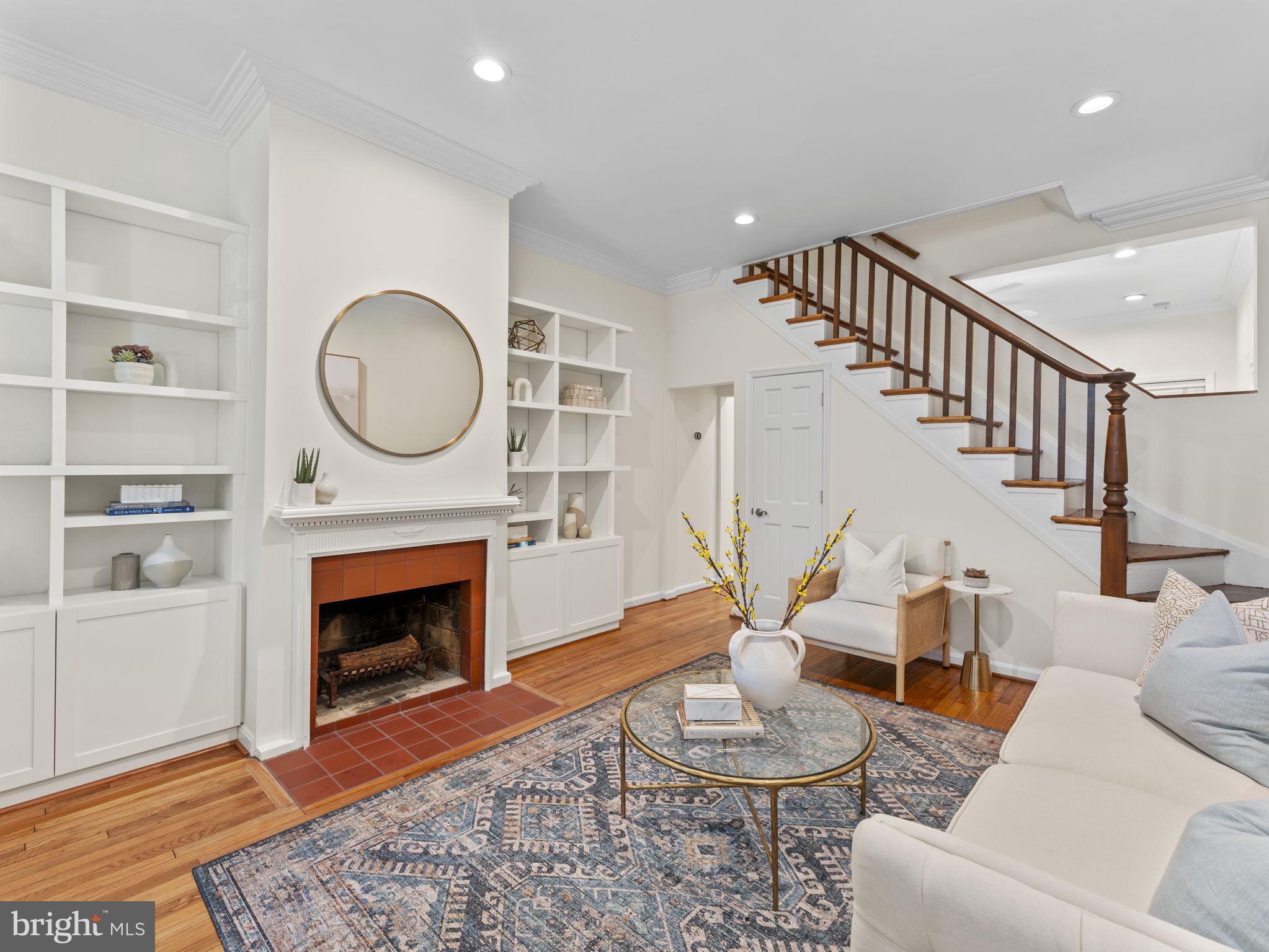 407 5th Street Northeast Washington, DC 20002 - Photo 2 of 41 a living room with furniture a window and a fireplace