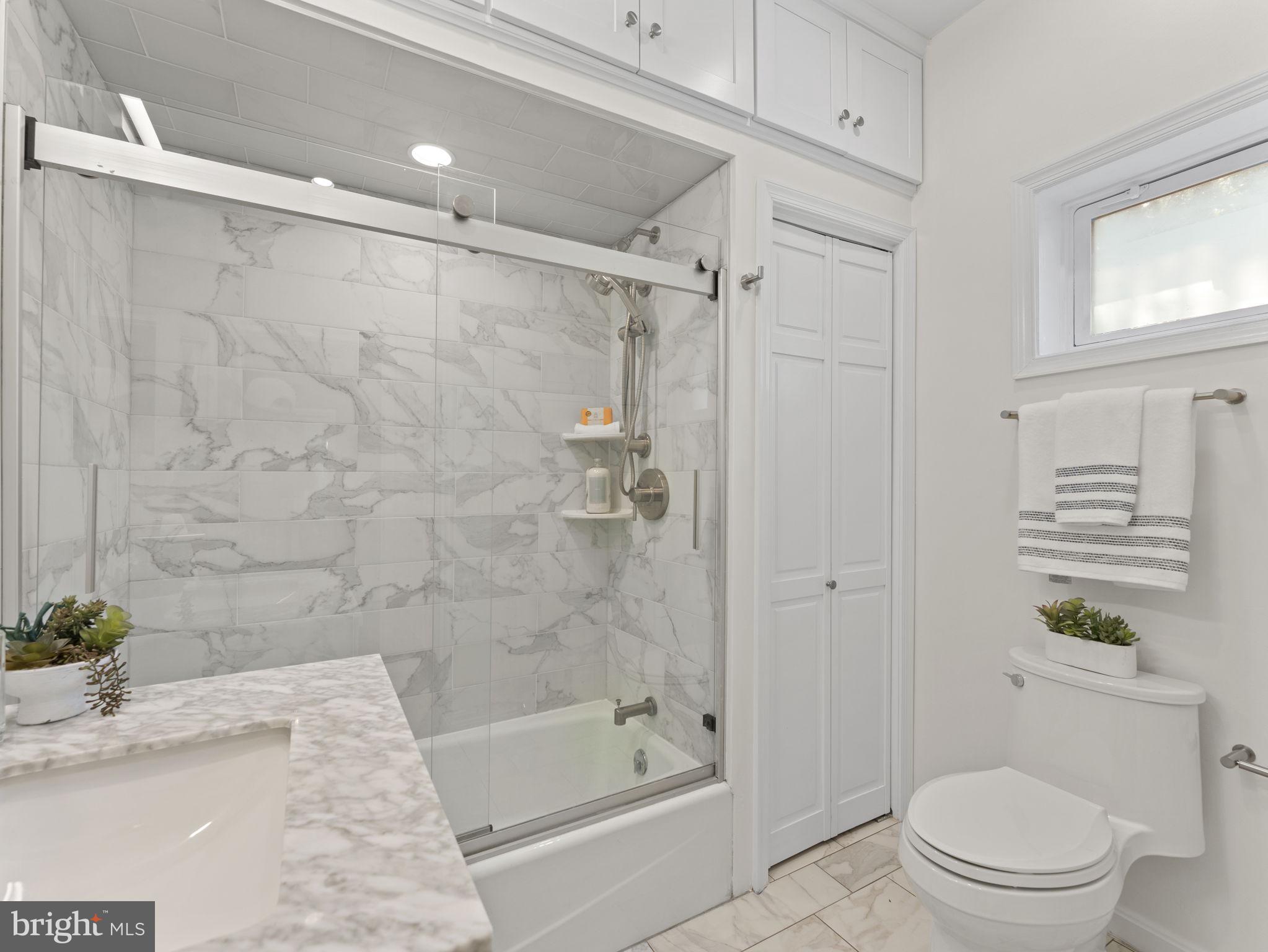 407 5th Street Northeast Washington, DC 20002 - Photo 22 of 41 a bathroom with a bathtub shower sink and toilet