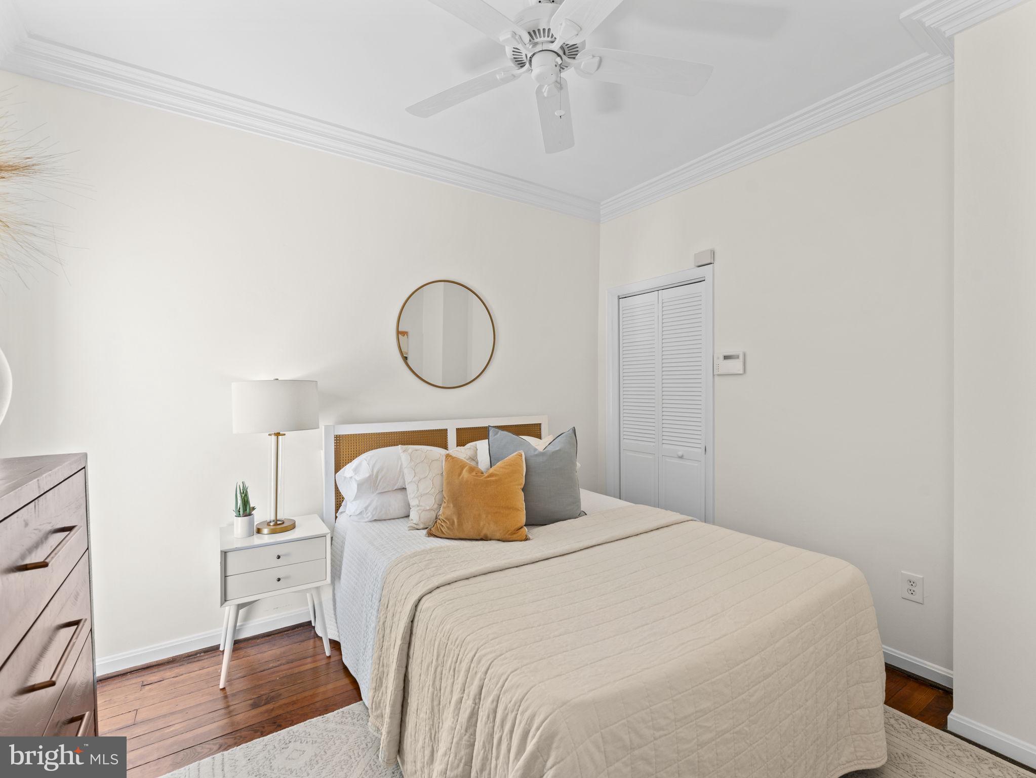 407 5th Street Northeast Washington, DC 20002 - Photo 23 of 41 a bedroom with a bed and wooden floor