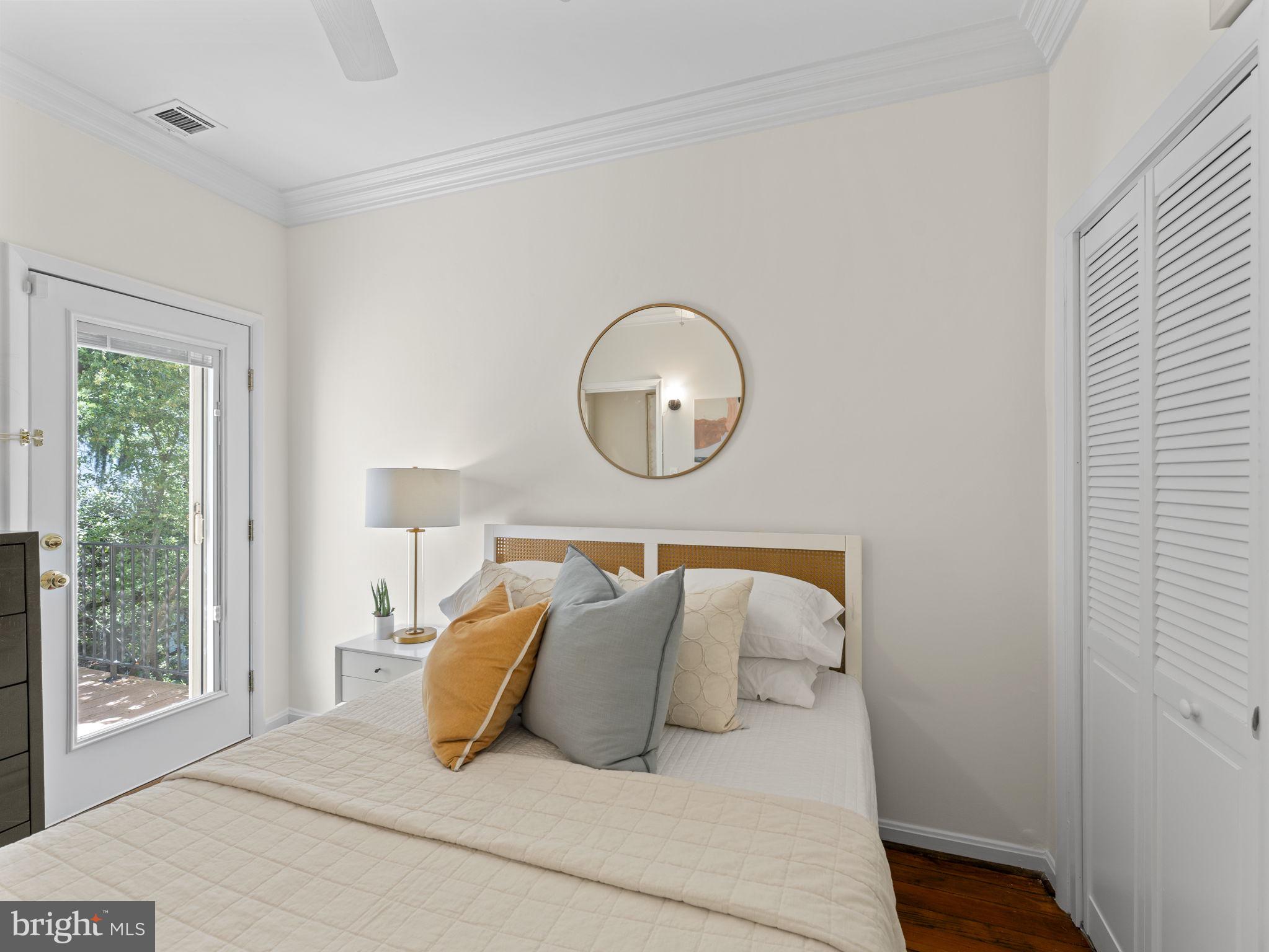 407 5th Street Northeast Washington, DC 20002 - Photo 24 of 41 a bedroom with a bed and window