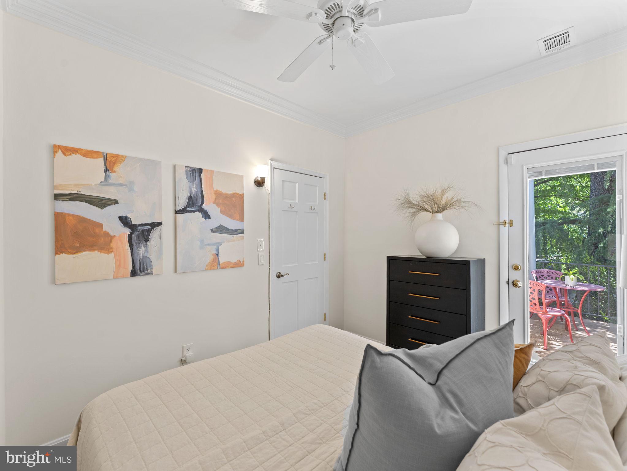 407 5th Street Northeast Washington, DC 20002 - Photo 25 of 41 a bedroom with a bed and wooden floor