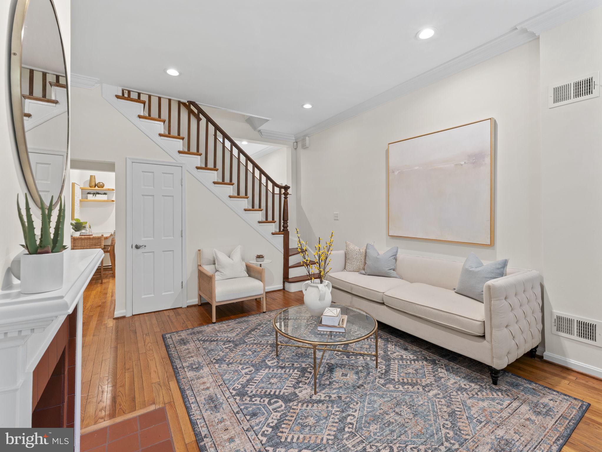 407 5th Street Northeast Washington, DC 20002 - Photo 4 of 41 a living room with furniture and a rug