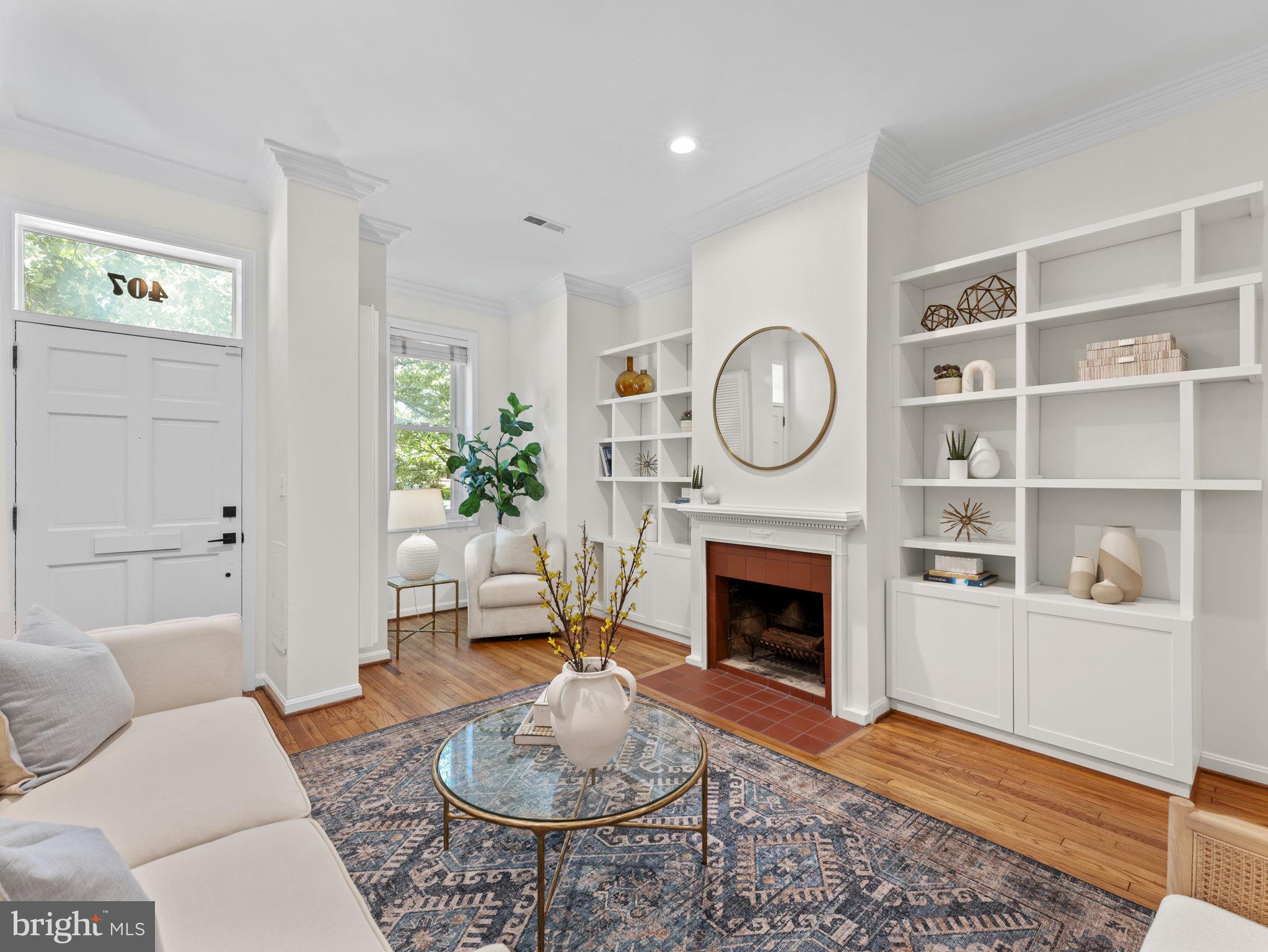 407 5th Street Northeast Washington, DC 20002 - Photo 6 of 41 a living room with furniture a rug and a fireplace