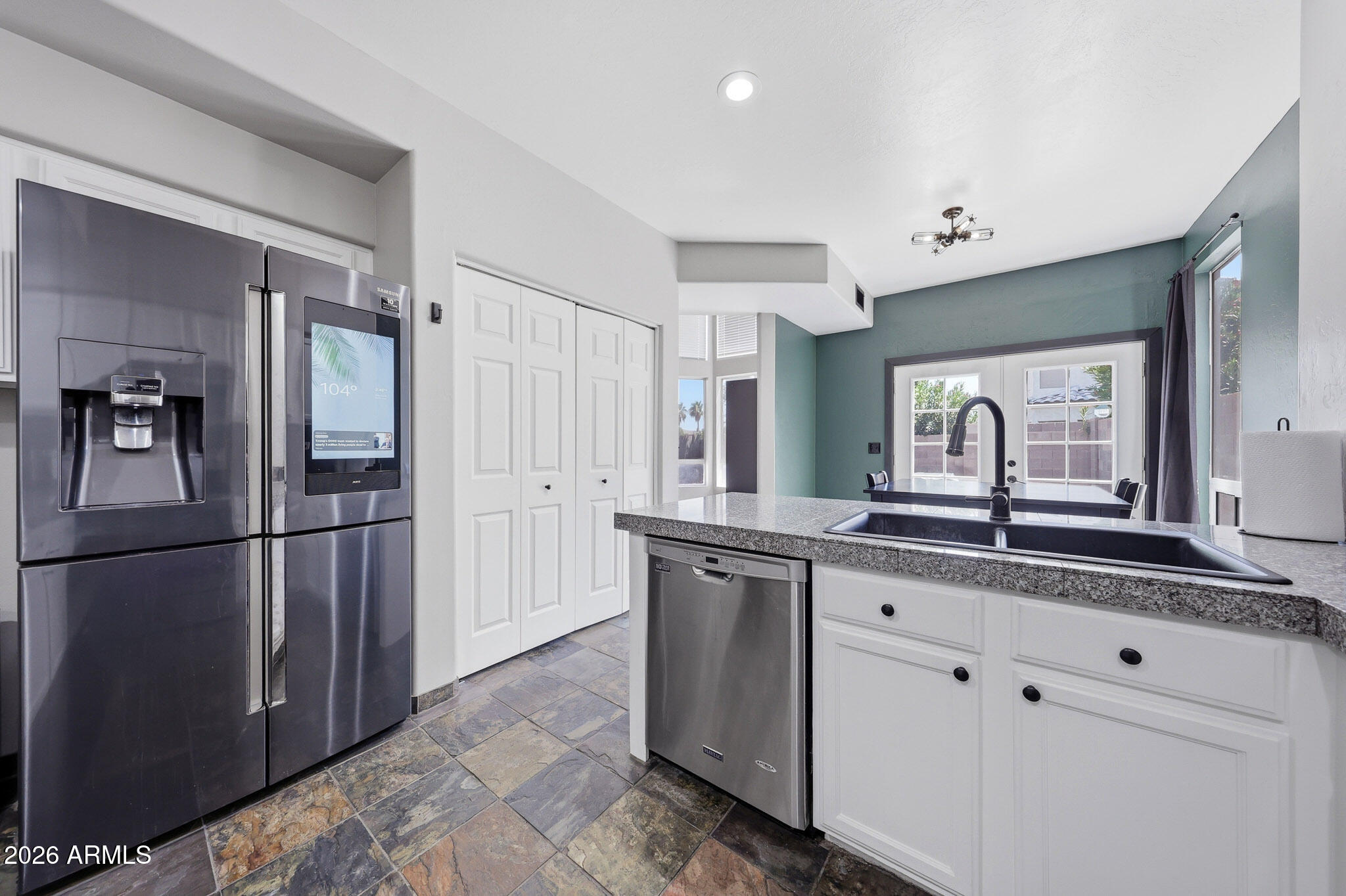 2167 East Nighthawk Way Phoenix, AZ 85048 - Photo 11 of 28 a kitchen with granite countertop a refrigerator and a sink