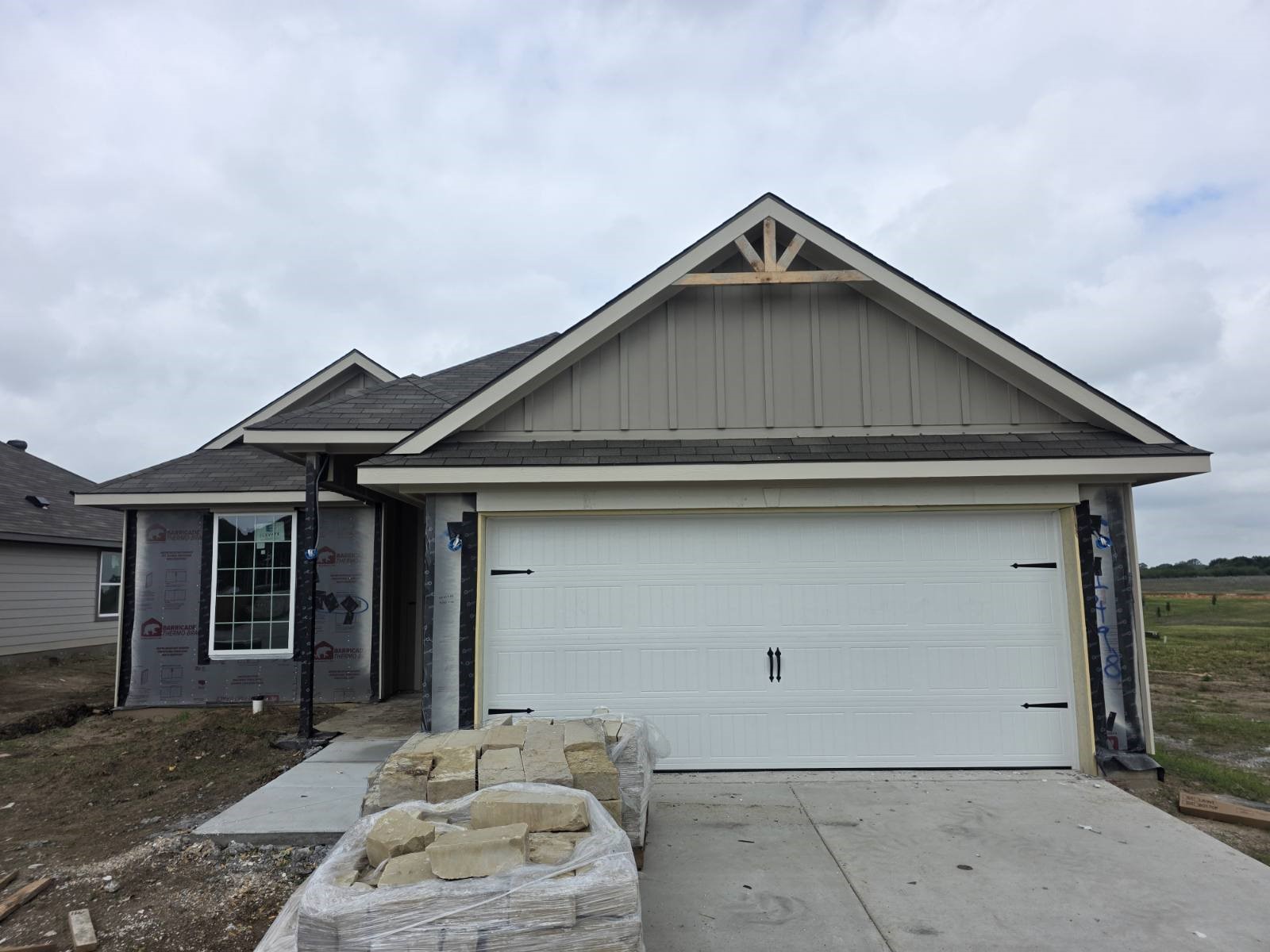1498 Lk Rdg Drive Brenham, TX 77833 - Photo 1 of 15 a front view of a house with garage