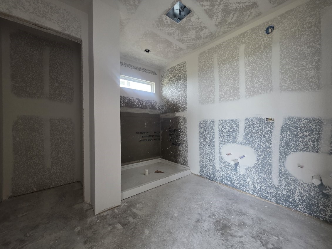 1498 Lk Rdg Drive Brenham, TX 77833 - Photo 6 of 15 a bathroom with a granite countertop sink a toilet and shower