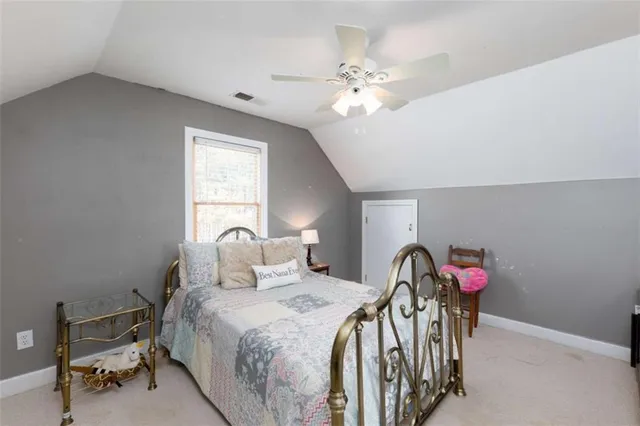 a view of a room with closet and a ceiling fan