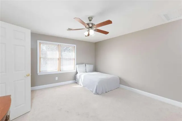 a kitchen with stainless steel appliances granite countertop a table chairs sink refrigerator and cabinets