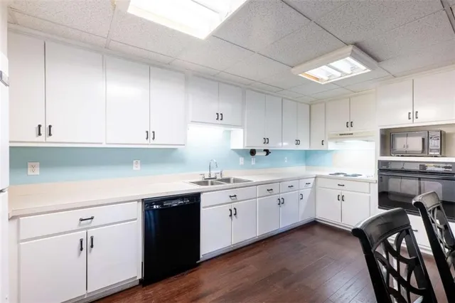 a bathroom with a sink vanity and toilet