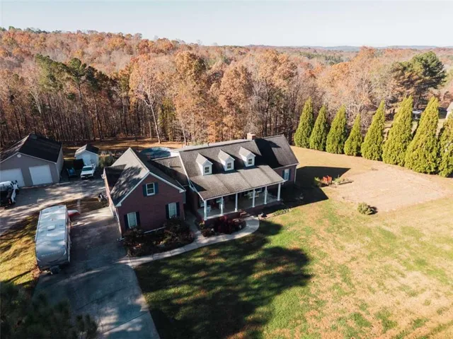 a view of a patio with iron fence