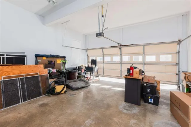 a view of house with deck outdoor seating and covered with wooden floor