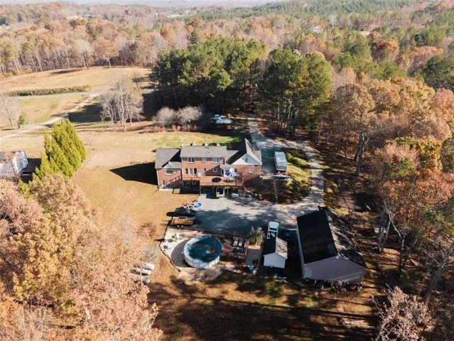 an aerial view of a house with roof deck