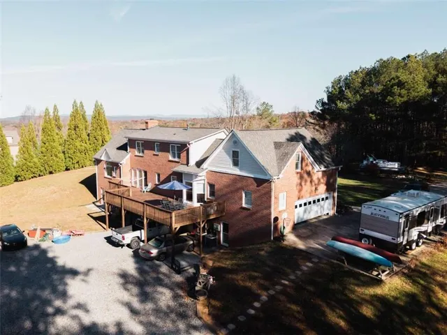 an aerial view of residential houses with outdoor space