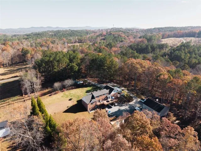 a view of a brick house with large windows
