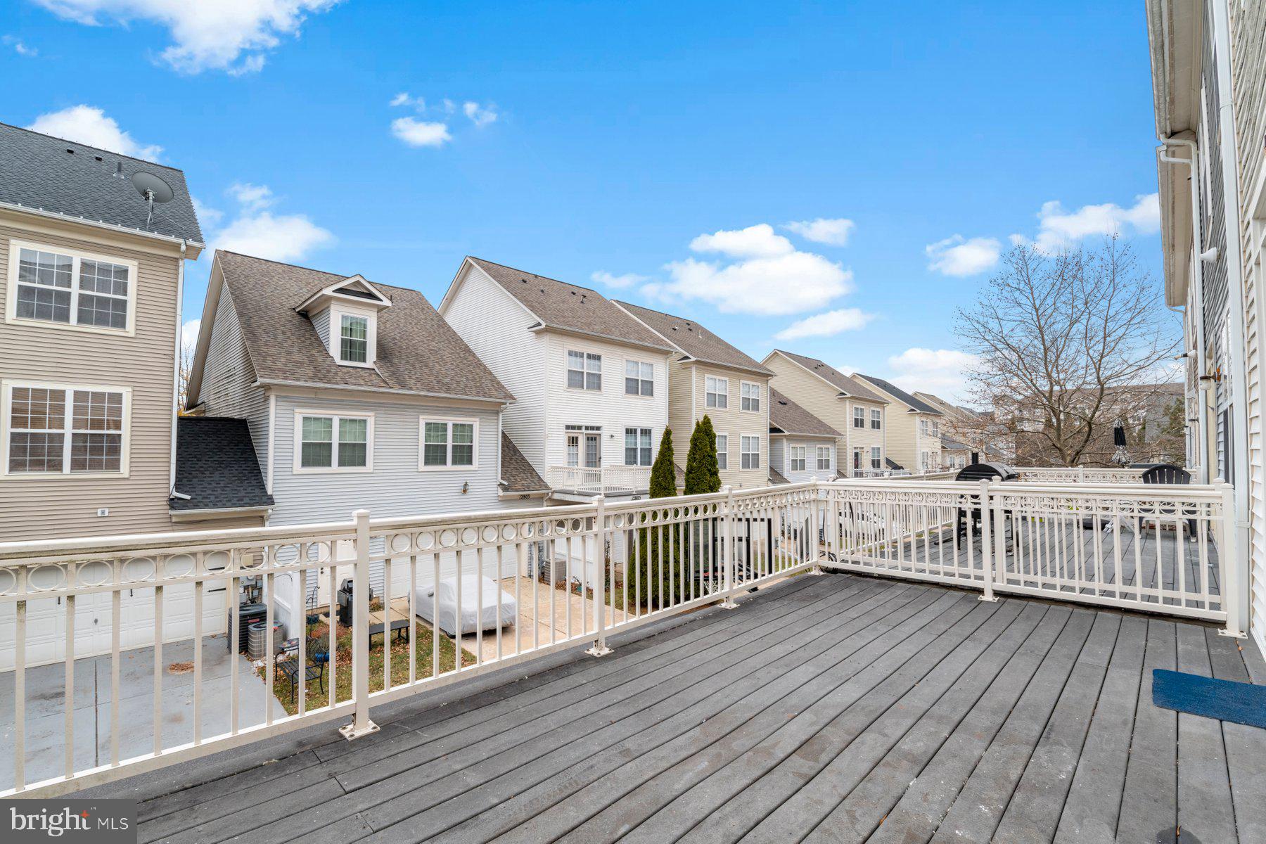 12802 Brightwell Drive Clarksburg, MD 20871 - Photo 12 of 30 a view of a house with wooden deck