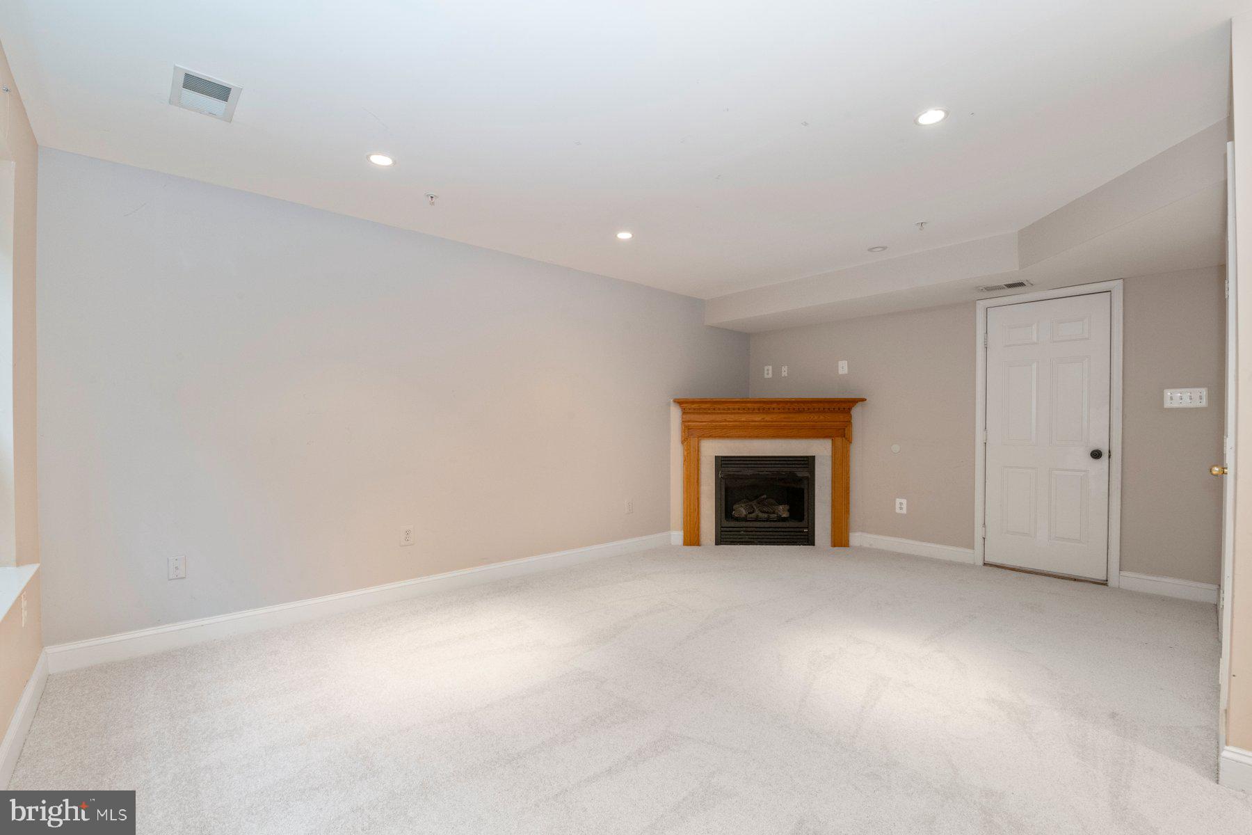 12802 Brightwell Drive Clarksburg, MD 20871 - Photo 15 of 30 a view of an empty room with a fireplace