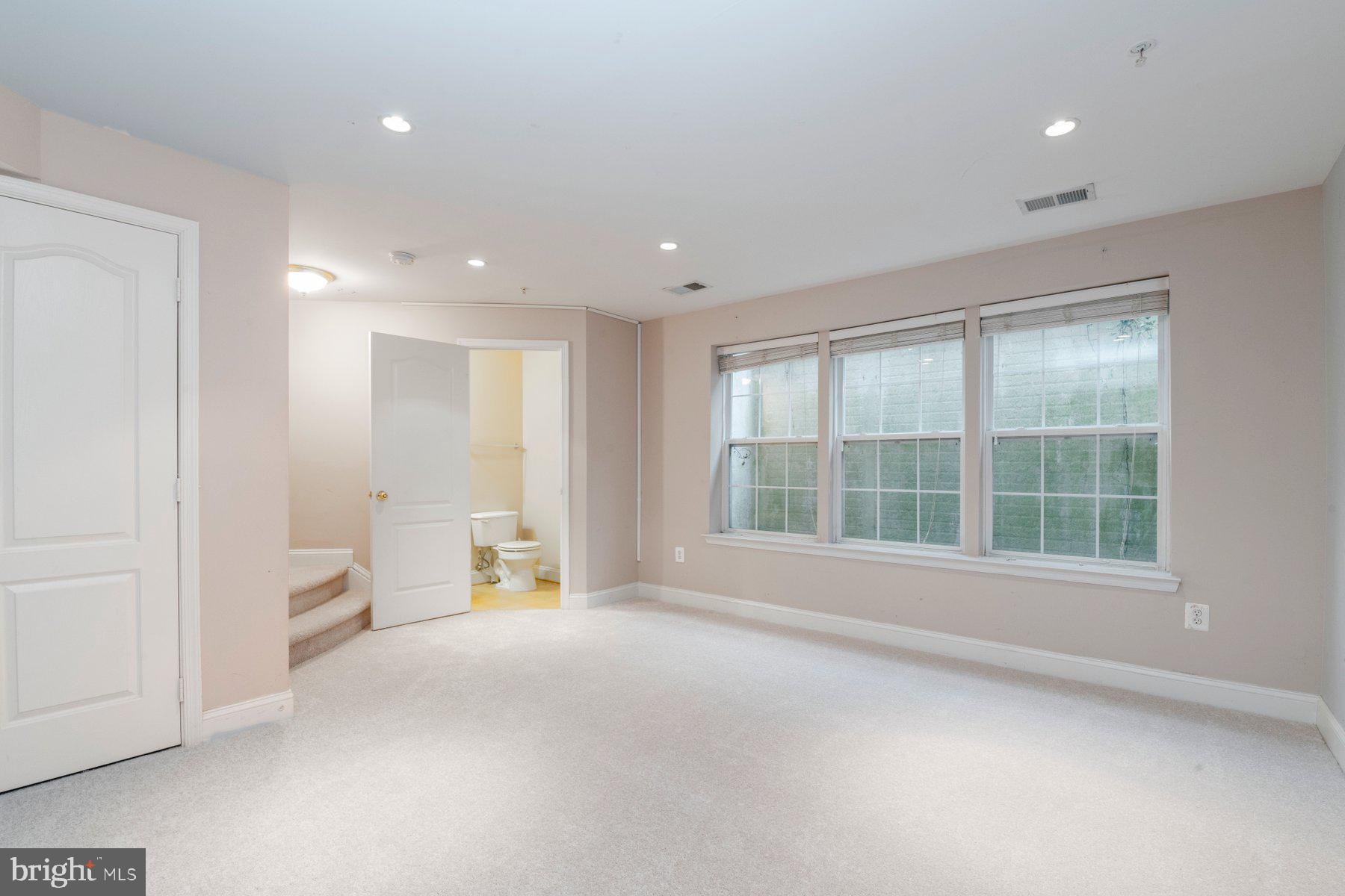 12802 Brightwell Drive Clarksburg, MD 20871 - Photo 16 of 30 a view of an empty room with a window and a kitchen