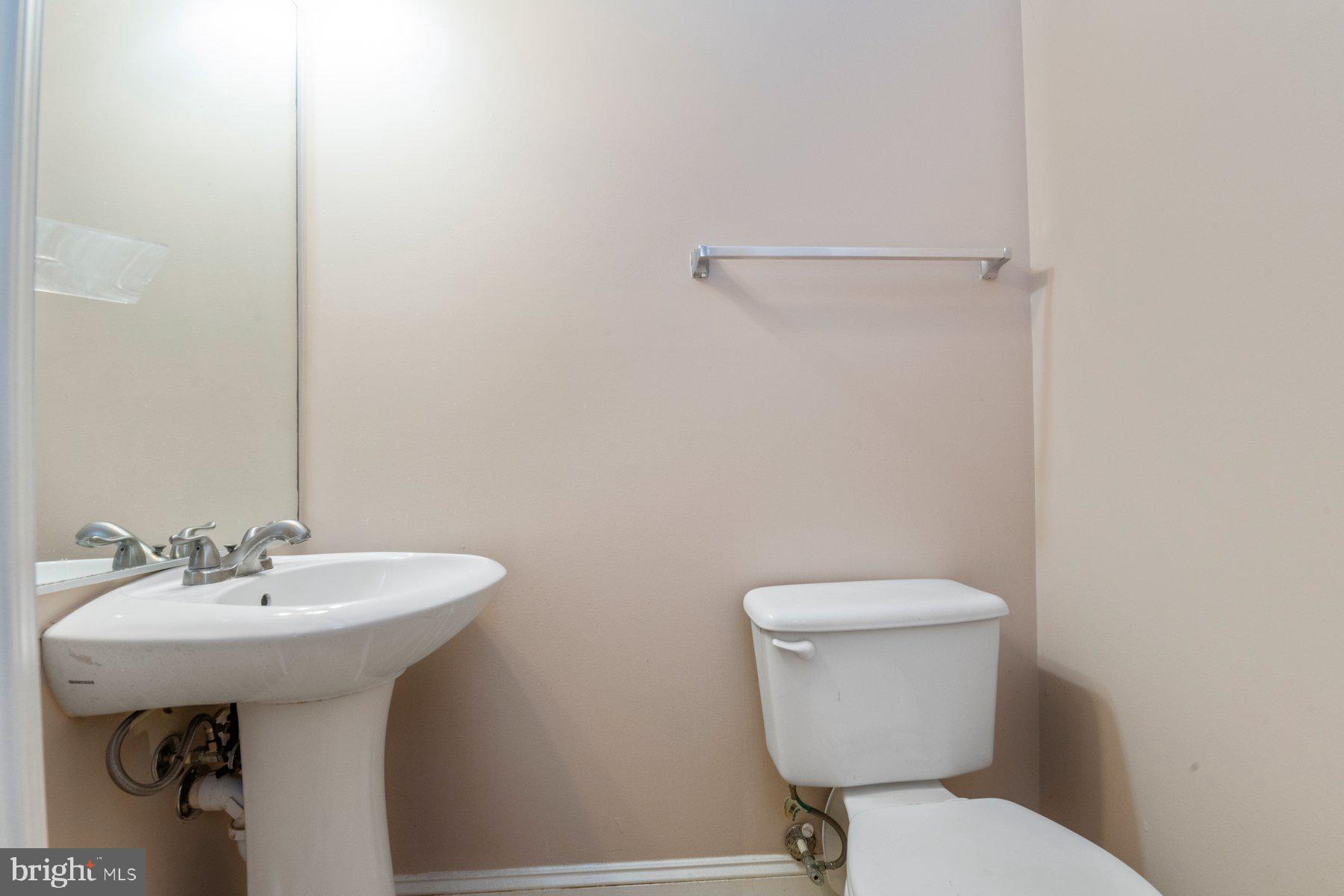 12802 Brightwell Drive Clarksburg, MD 20871 - Photo 17 of 30 a bathroom with a sink a toilet and mirror