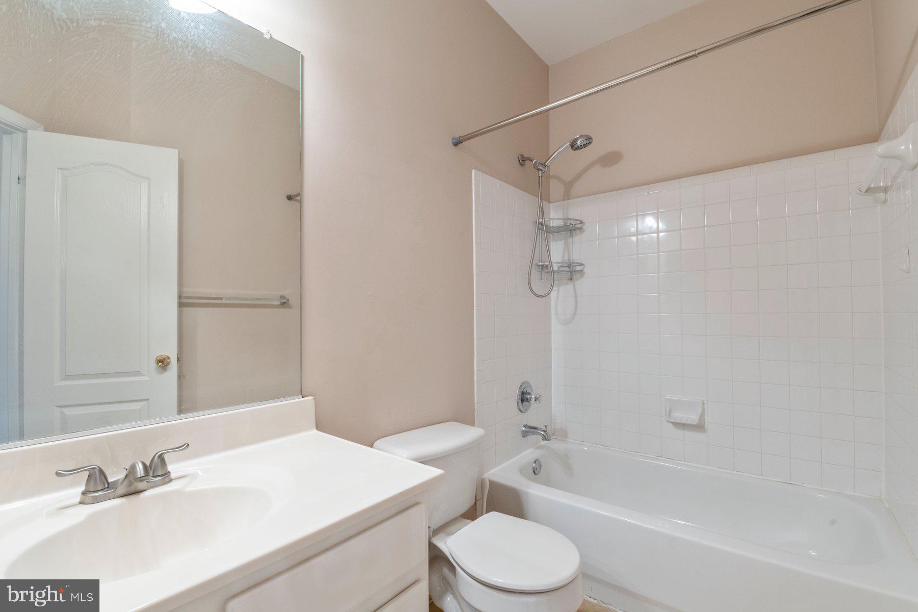 12802 Brightwell Drive Clarksburg, MD 20871 - Photo 25 of 30 a bathroom with a sink a toilet and a bathtub
