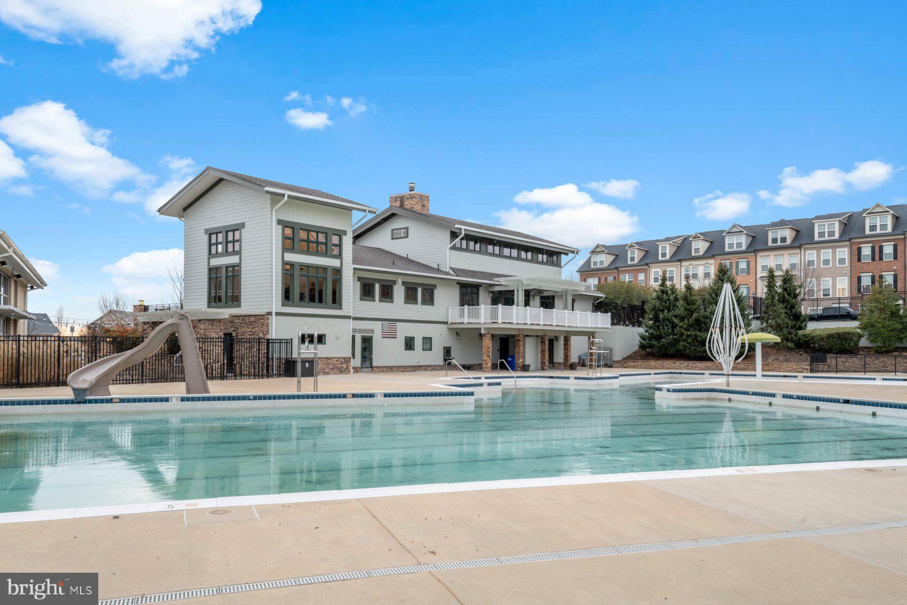 12802 Brightwell Drive Clarksburg, MD 20871 - Photo 27 of 30 a house view with swimming pool and sitting space