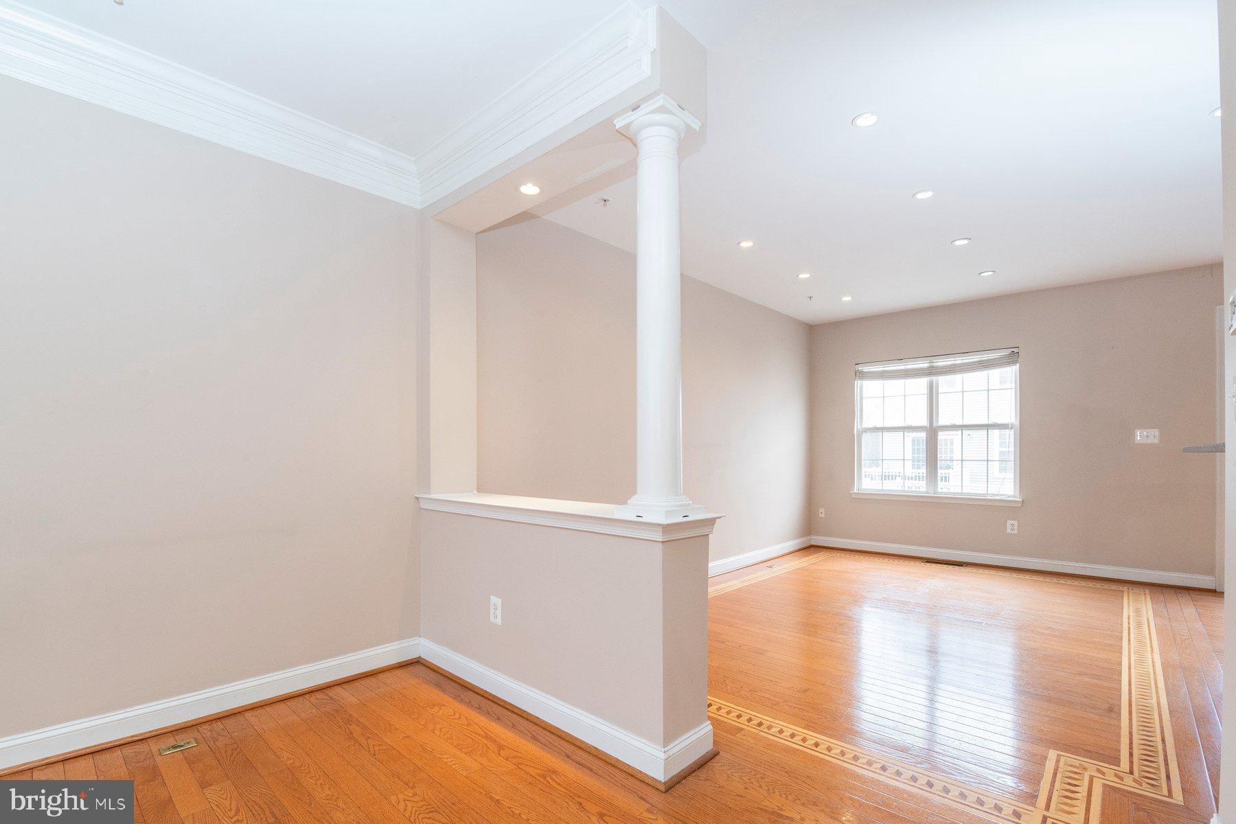 12802 Brightwell Drive Clarksburg, MD 20871 - Photo 6 of 30 an empty room with wooden floor and windows