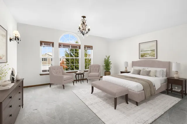 a bedroom with a bed and window