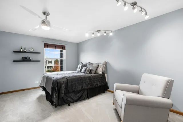 a kitchen with stainless steel appliances granite countertop a sink and a refrigerator