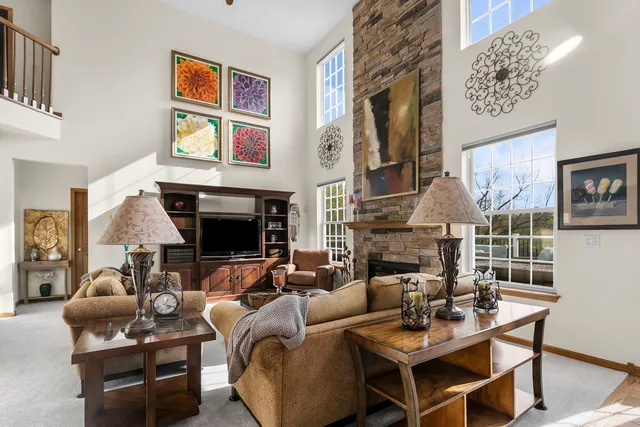 a kitchen with stainless steel appliances granite countertop a refrigerator a stove and a sink