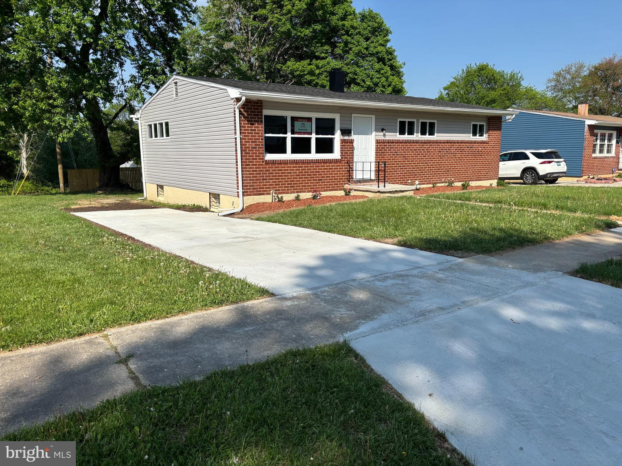 9016 Samoset Road Randallstown, MD 21133 - Photo 1 of 36 a front view of a house with a yard and garage