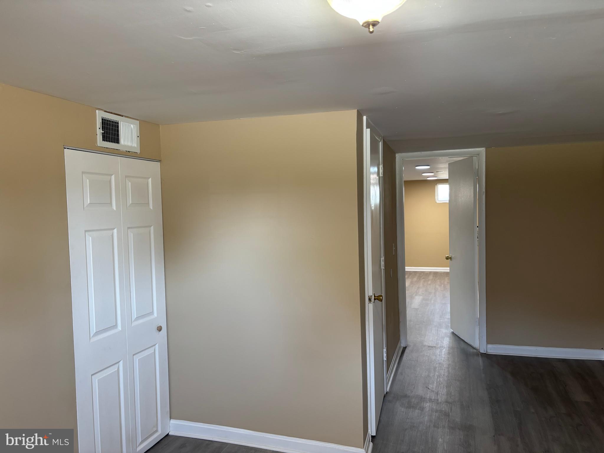 9016 Samoset Road Randallstown, MD 21133 - Photo 17 of 36 a view of a hallway with wooden floor