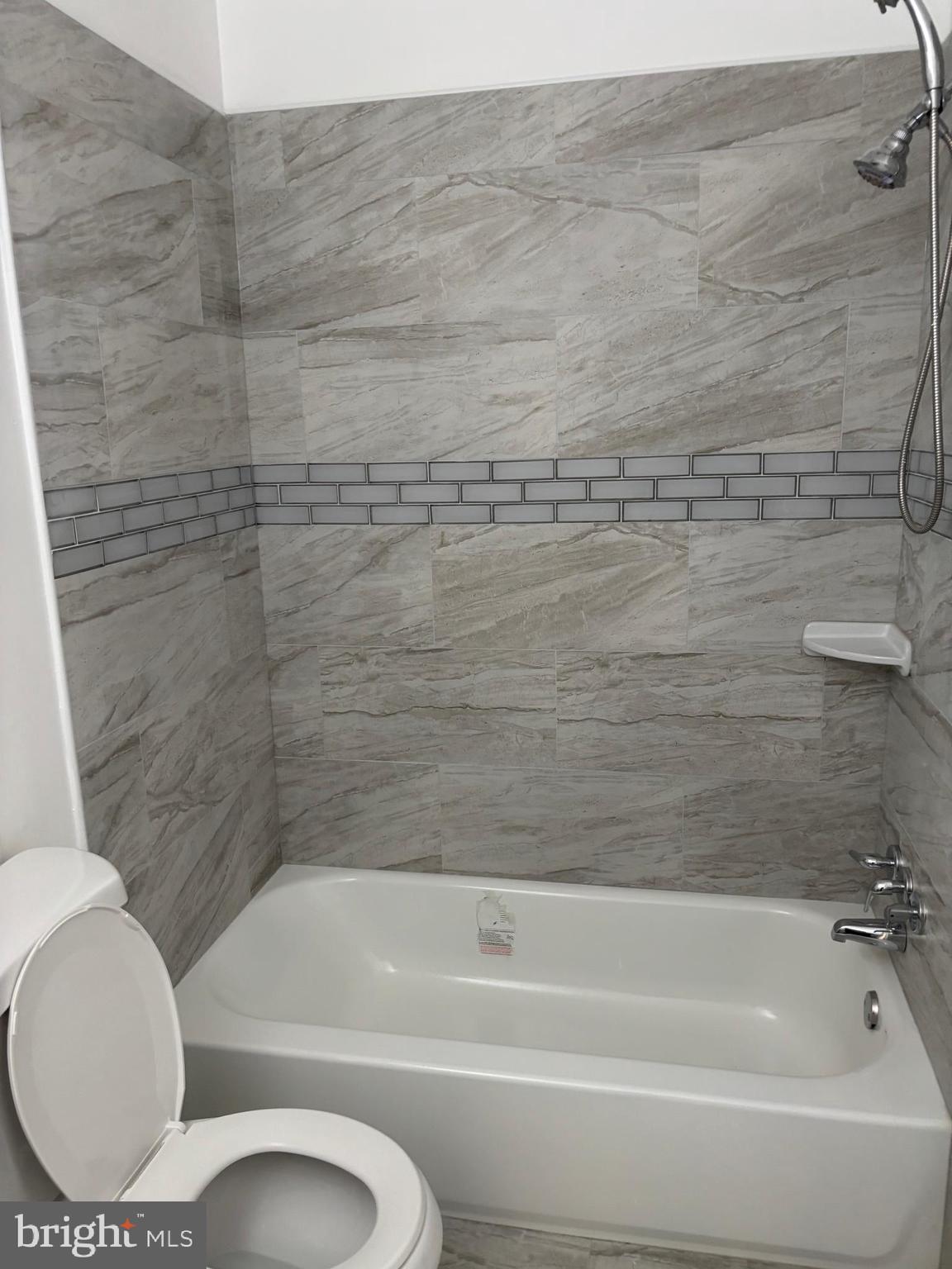 9016 Samoset Road Randallstown, MD 21133 - Photo 24 of 36 a bathroom with a toilet and a bathtub