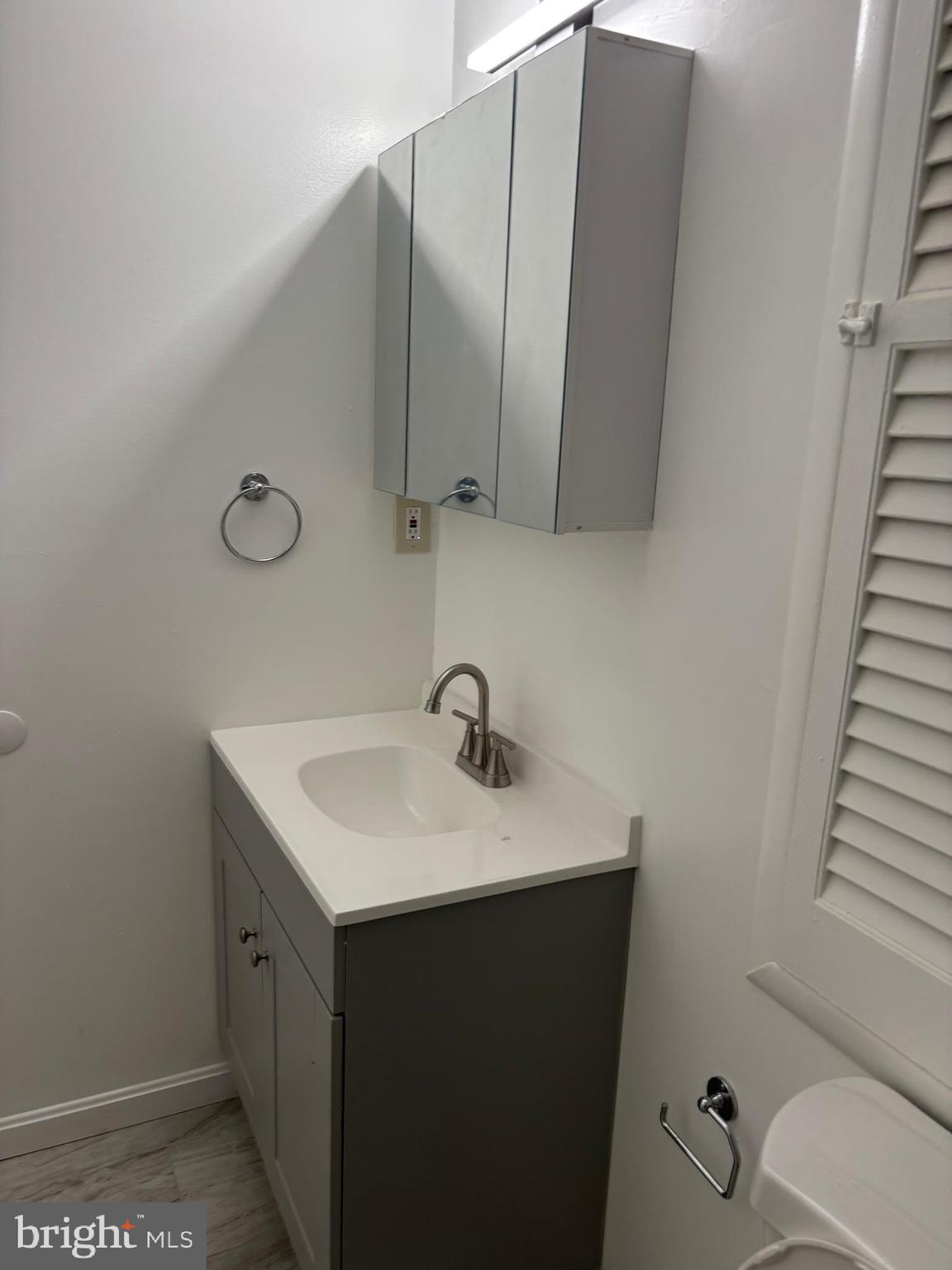 9016 Samoset Road Randallstown, MD 21133 - Photo 28 of 36 a bathroom with a sink toilet and mirror