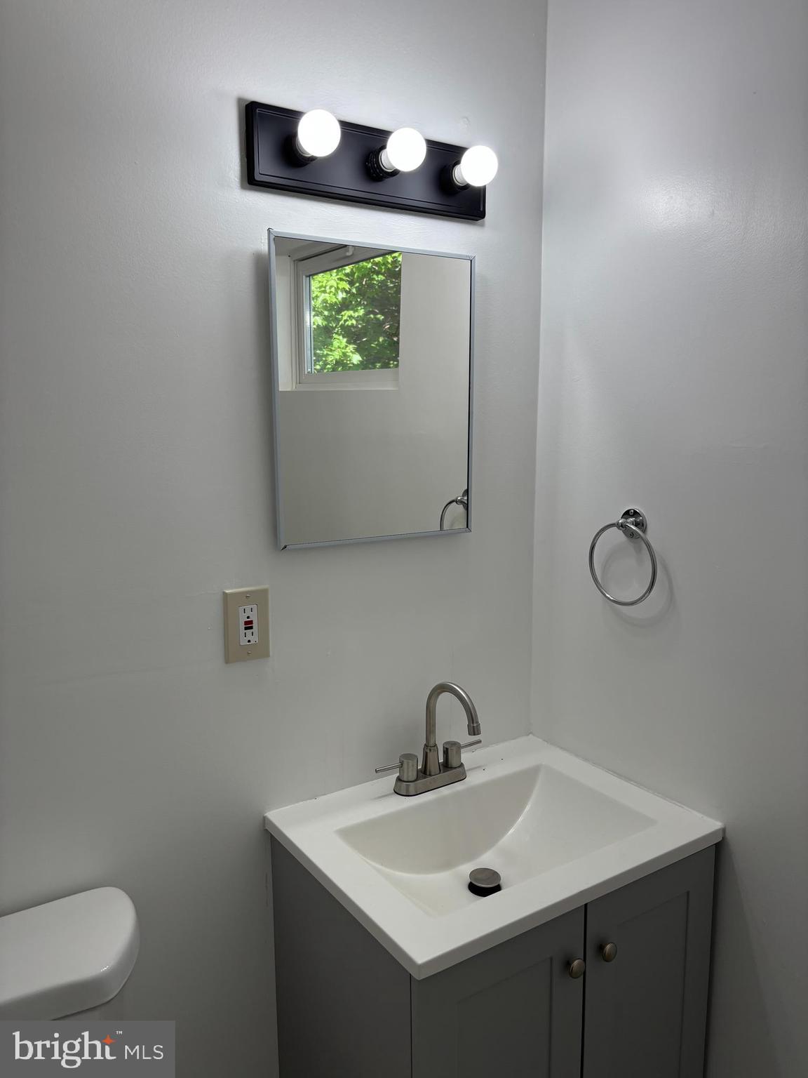 9016 Samoset Road Randallstown, MD 21133 - Photo 29 of 36 a bathroom with a sink and a mirror