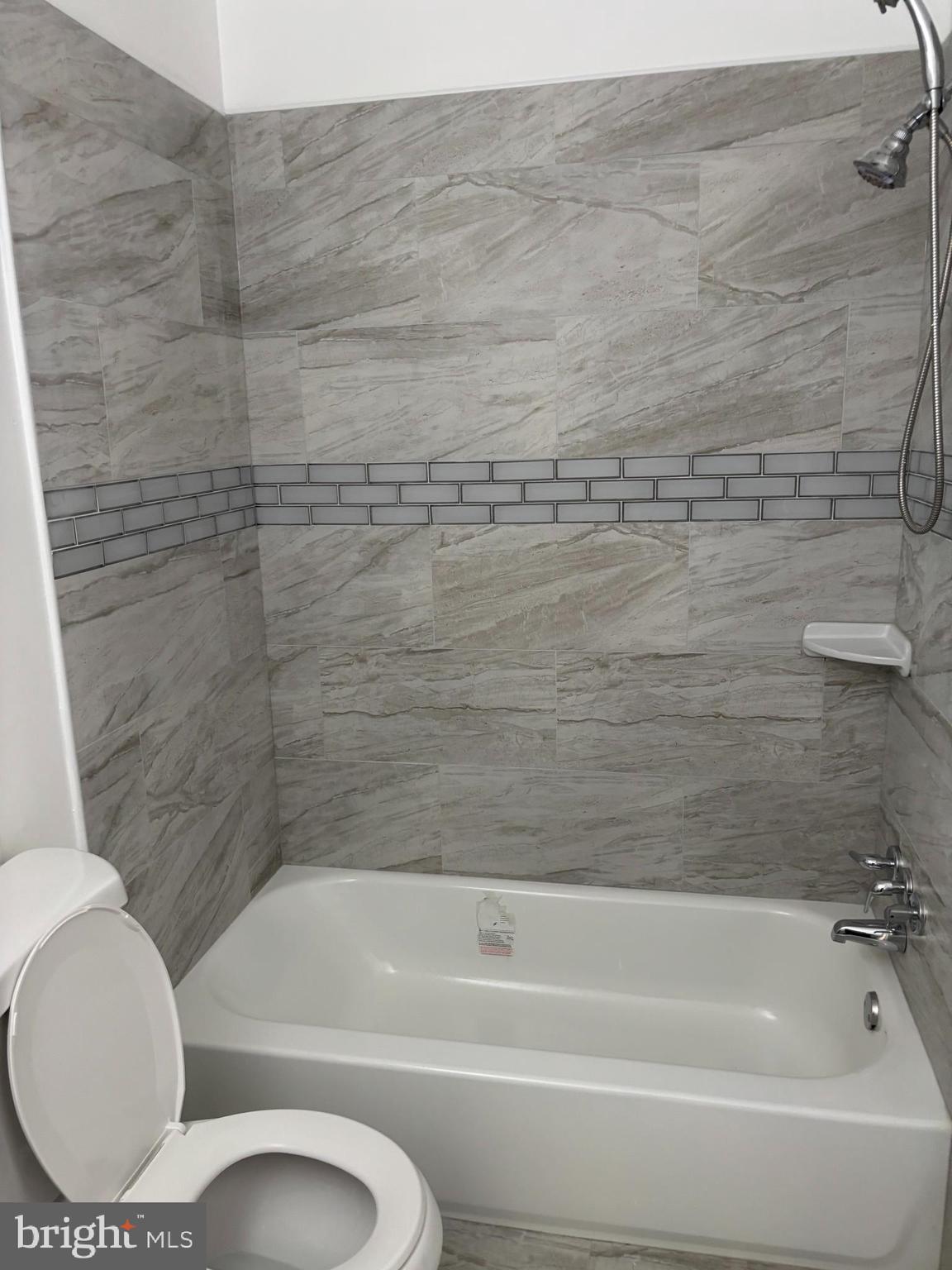 9016 Samoset Road Randallstown, MD 21133 - Photo 33 of 36 a bathroom with a toilet and a bathtub