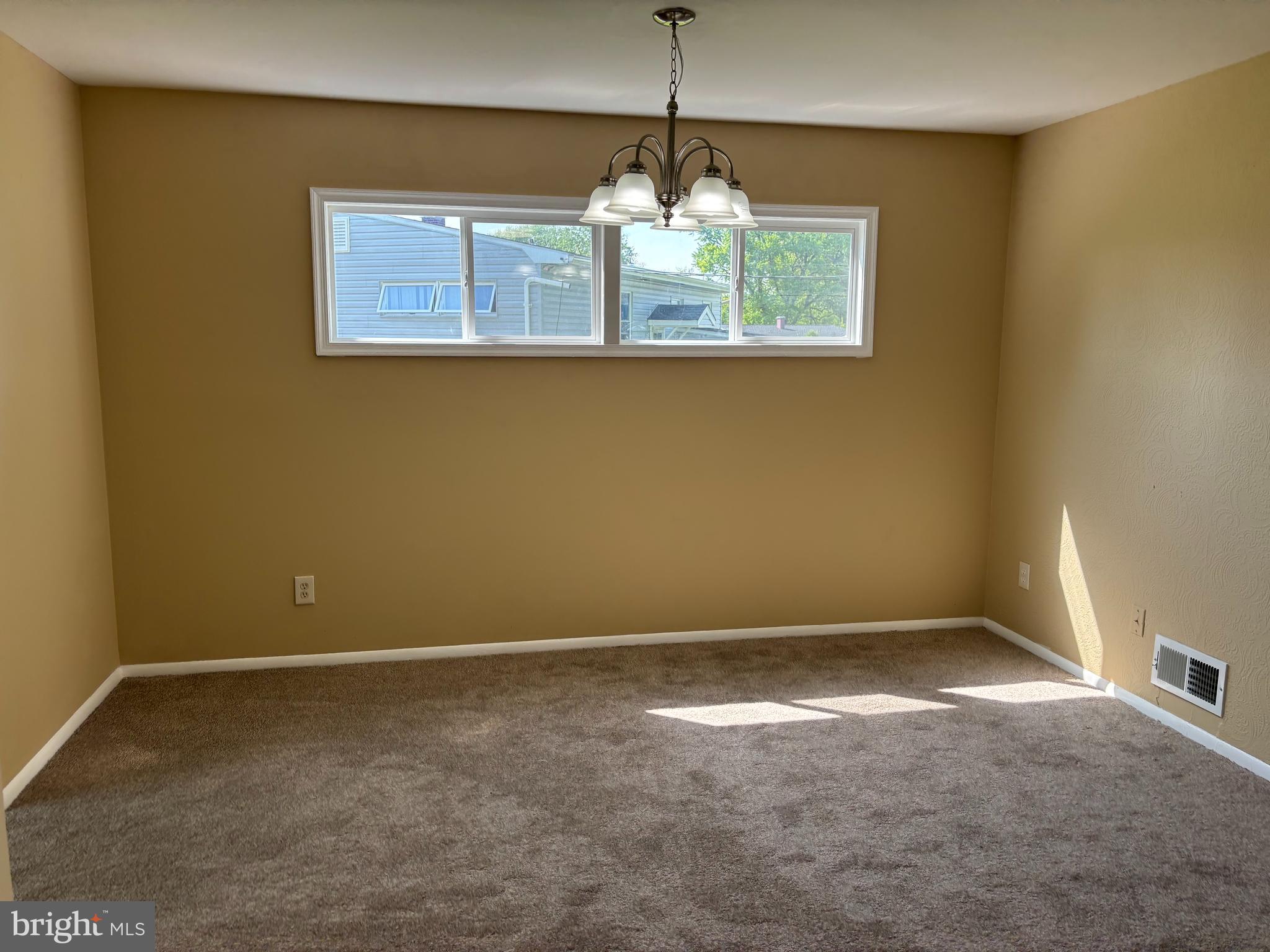 9016 Samoset Road Randallstown, MD 21133 - Photo 6 of 36 a view of an empty room with a window