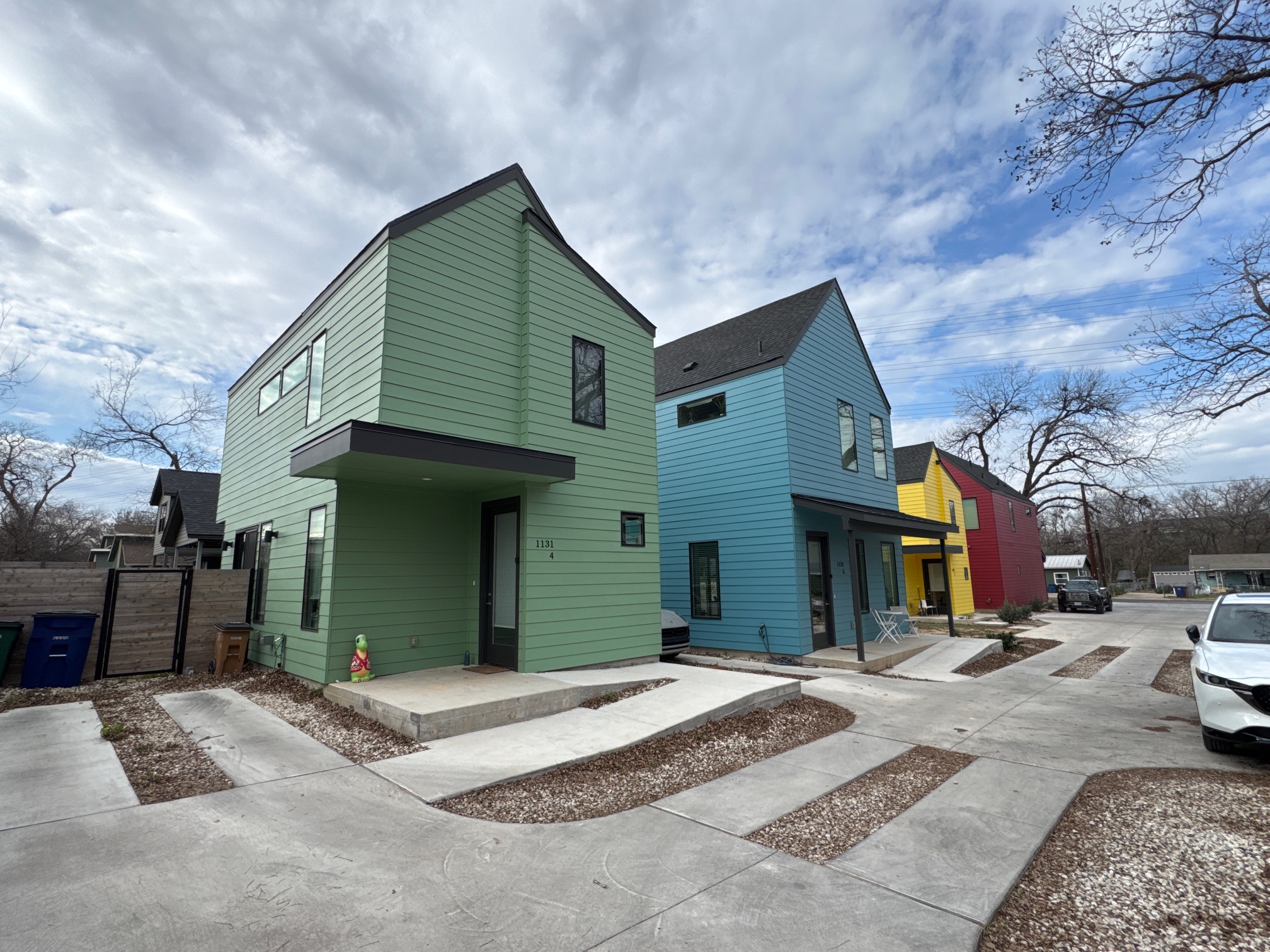 1131 Walton Lane, Unit 4 Austin, TX 78721 - Photo 3 of 13 a front view of a house with a yard