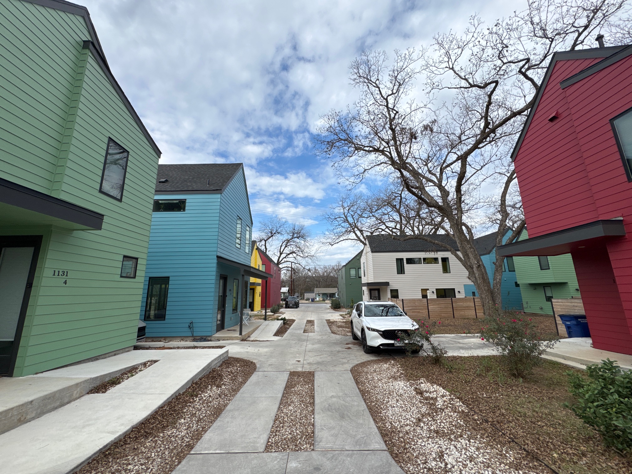 1131 Walton Lane, Unit 4 Austin, TX 78721 - Photo 4 of 13 a view of a car park in front of a building