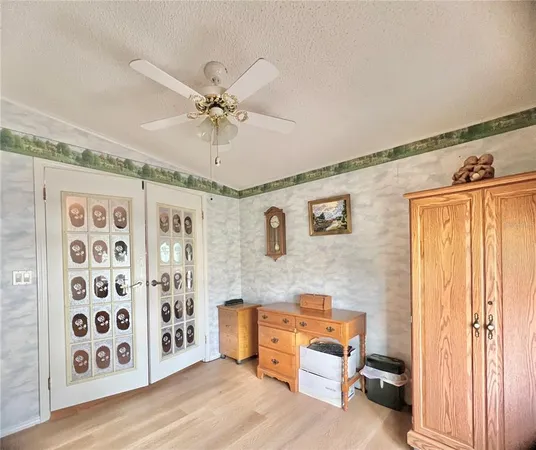 a spacious bedroom with a bed and a table in it