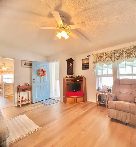 a bedroom with furniture and a flat screen tv