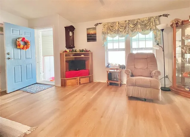 a bedroom with furniture and a window