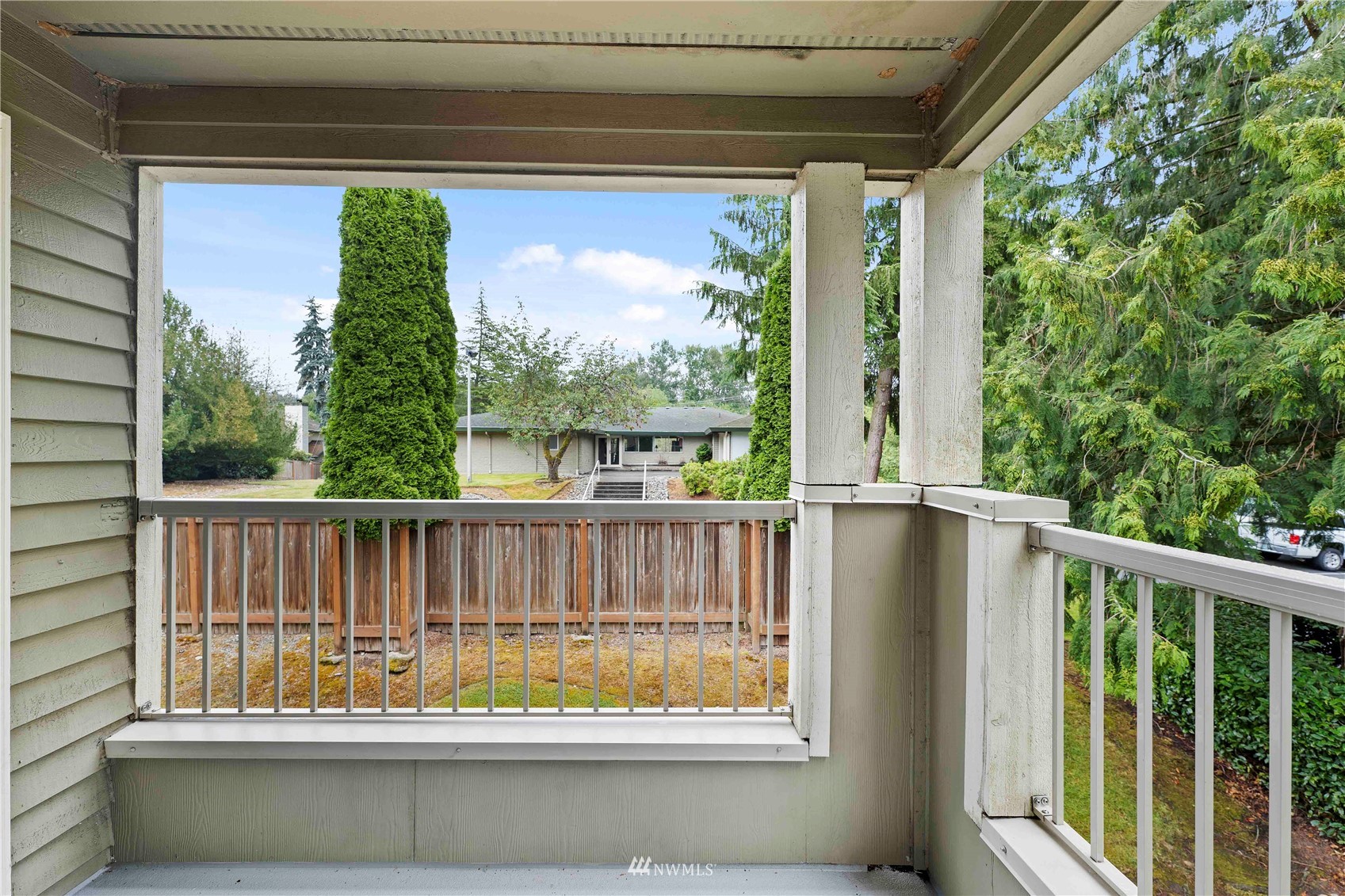 20318 Bothell Everett Highway, Unit A202 Bothell, WA 98012 - Photo 13 of 28 a view of balcony with furniture