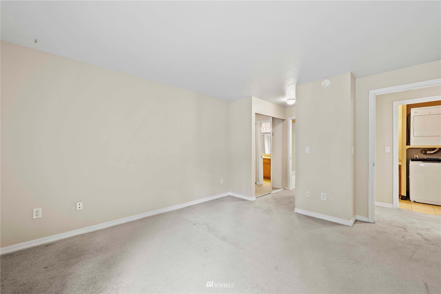20318 Bothell Everett Highway, Unit A202 Bothell, WA 98012 - Photo 16 of 28 wooden floor in an empty room