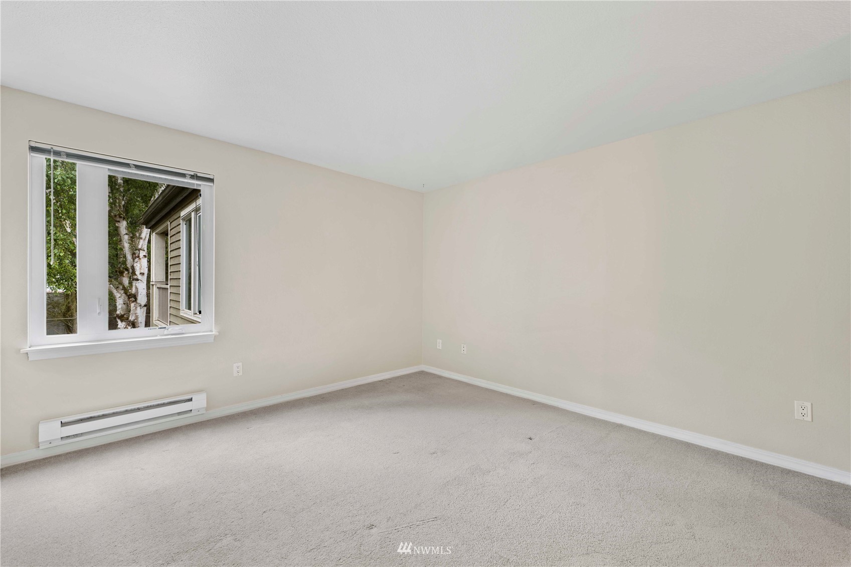 20318 Bothell Everett Highway, Unit A202 Bothell, WA 98012 - Photo 17 of 28 an empty room with a window
