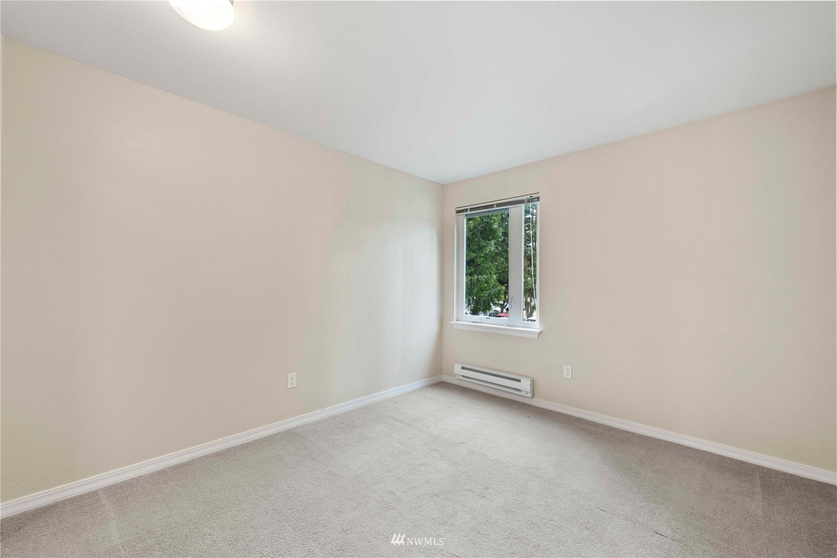 20318 Bothell Everett Highway, Unit A202 Bothell, WA 98012 - Photo 21 of 28 an empty room with a window