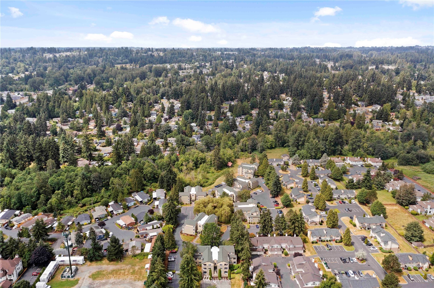 20318 Bothell Everett Highway, Unit A202 Bothell, WA 98012 - Photo 23 of 28 an aerial view of a house with a yard