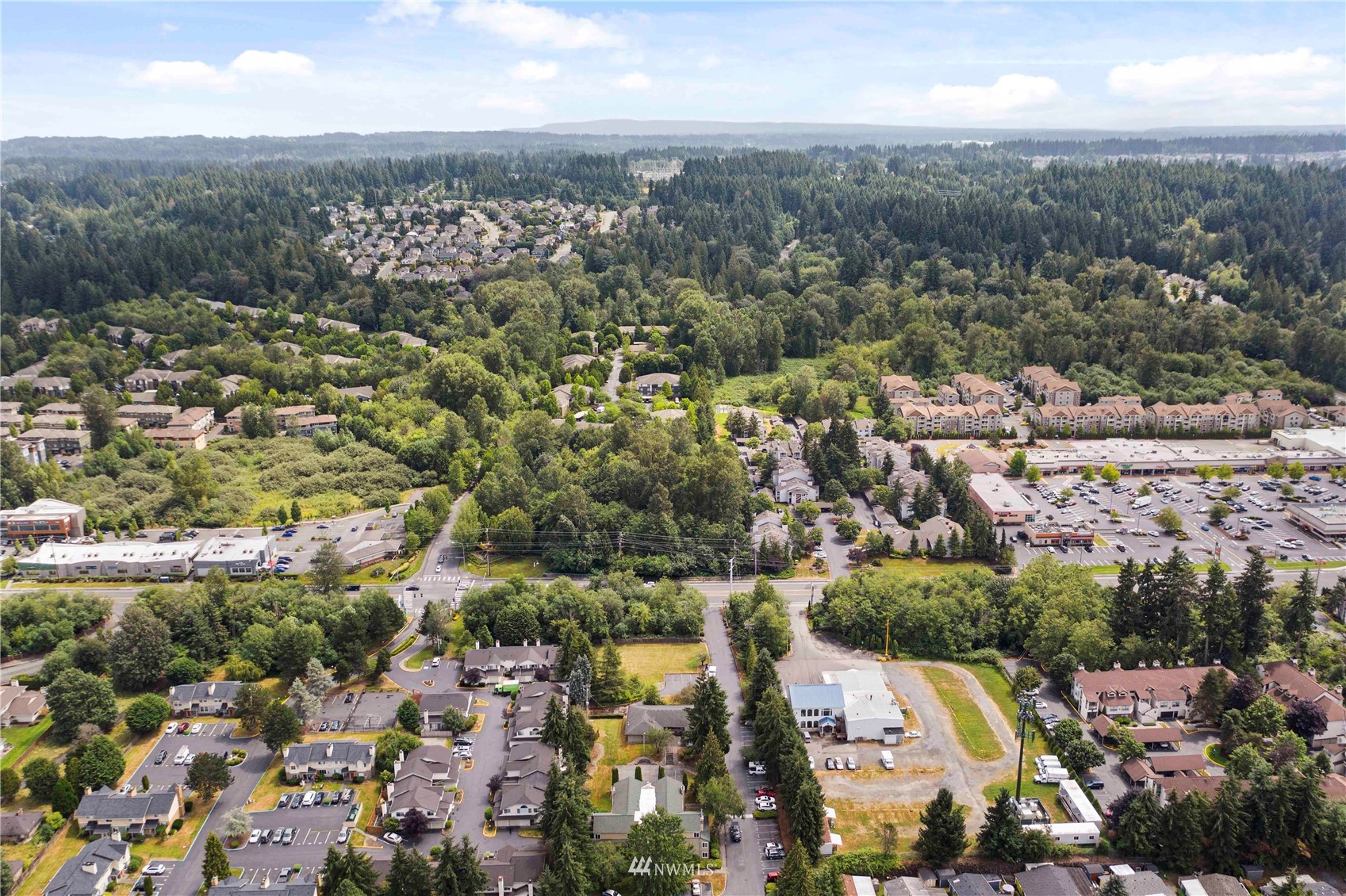 20318 Bothell Everett Highway, Unit A202 Bothell, WA 98012 - Photo 24 of 28 an aerial view of residential houses with city view