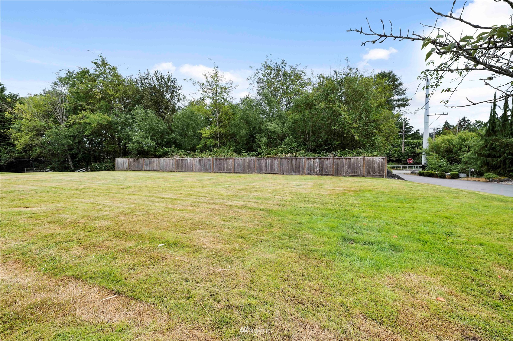 20318 Bothell Everett Highway, Unit A202 Bothell, WA 98012 - Photo 28 of 28 a view of a swimming pool and trees in the background