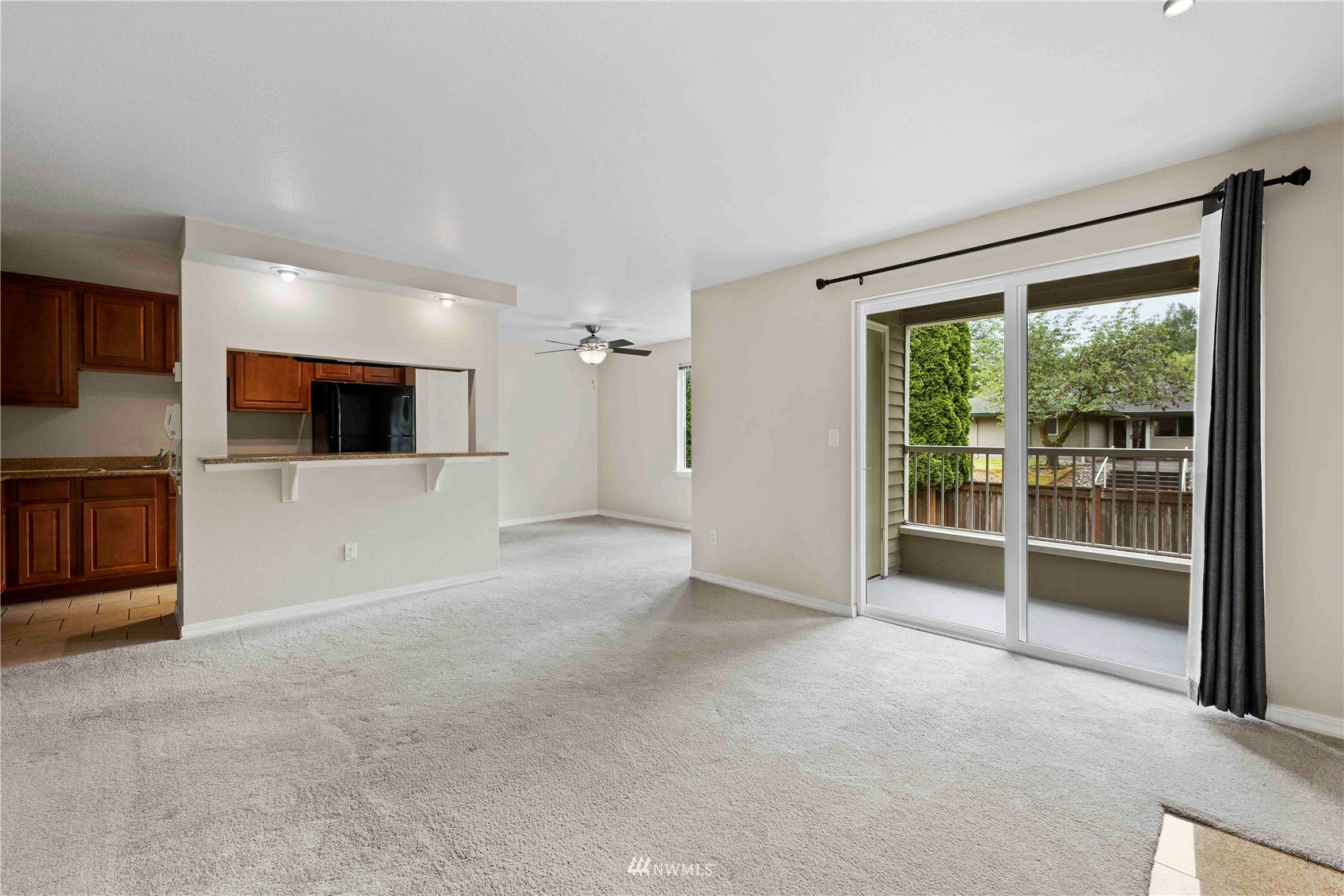 20318 Bothell Everett Highway, Unit A202 Bothell, WA 98012 - Photo 7 of 28 a view of a livingroom with a flat screen tv