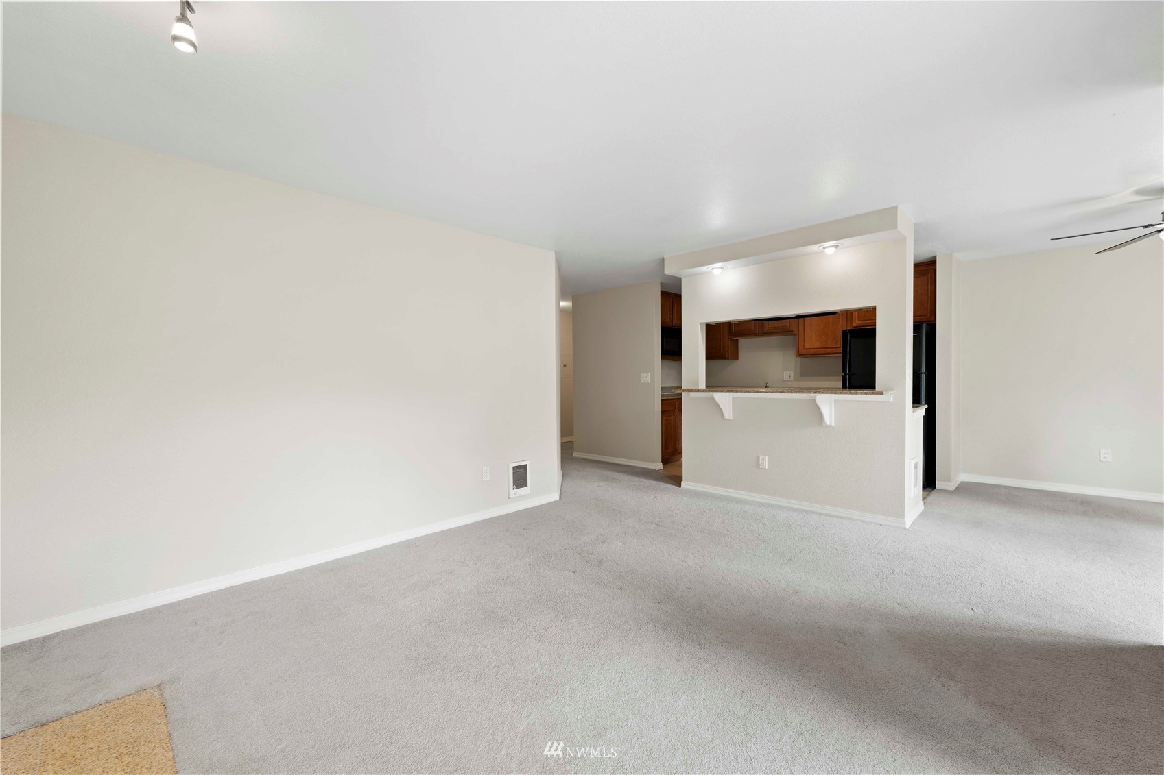 20318 Bothell Everett Highway, Unit A202 Bothell, WA 98012 - Photo 8 of 28 a view of a livingroom and a dishwasher